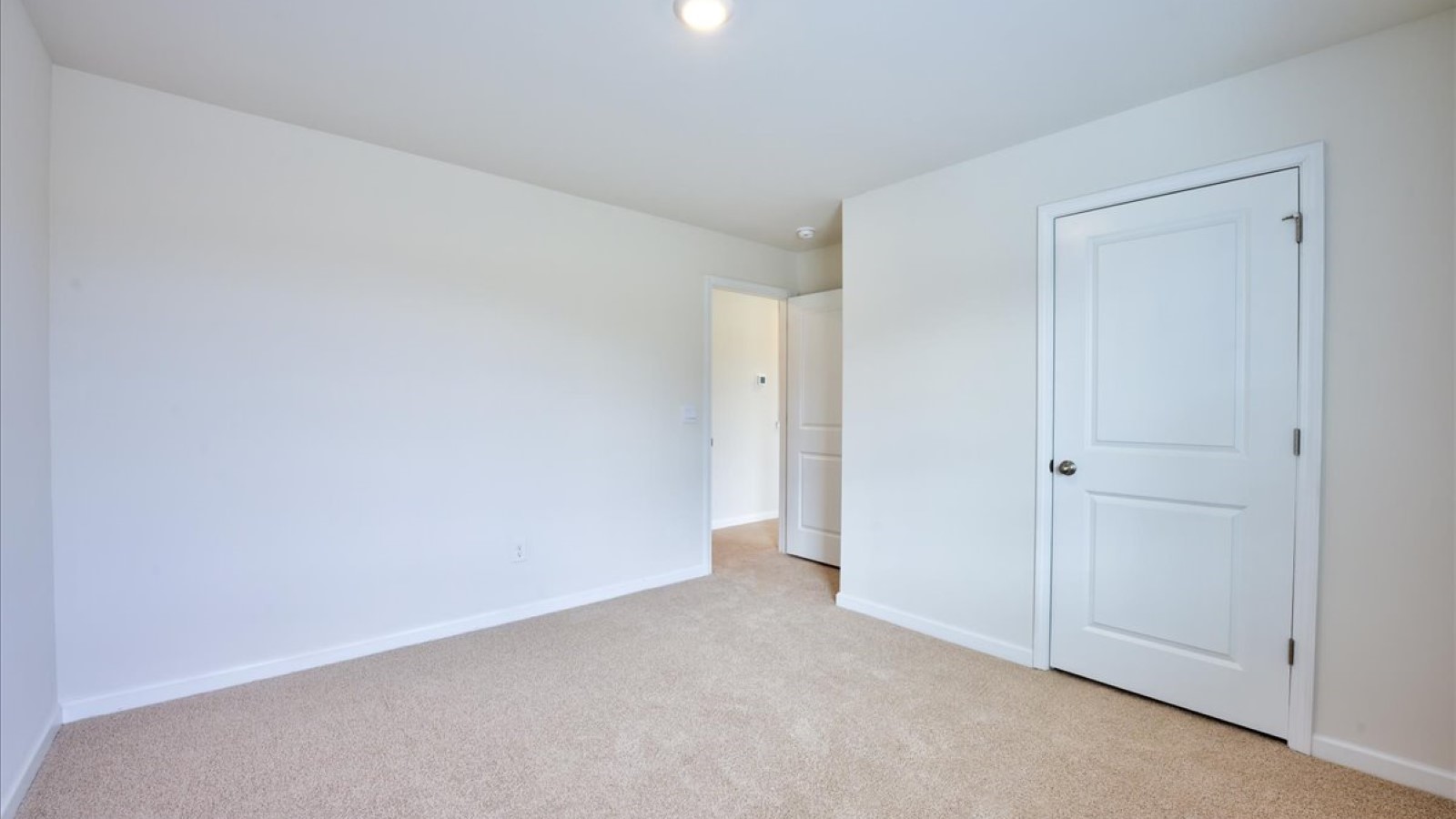 Bedroom with carpet flooring