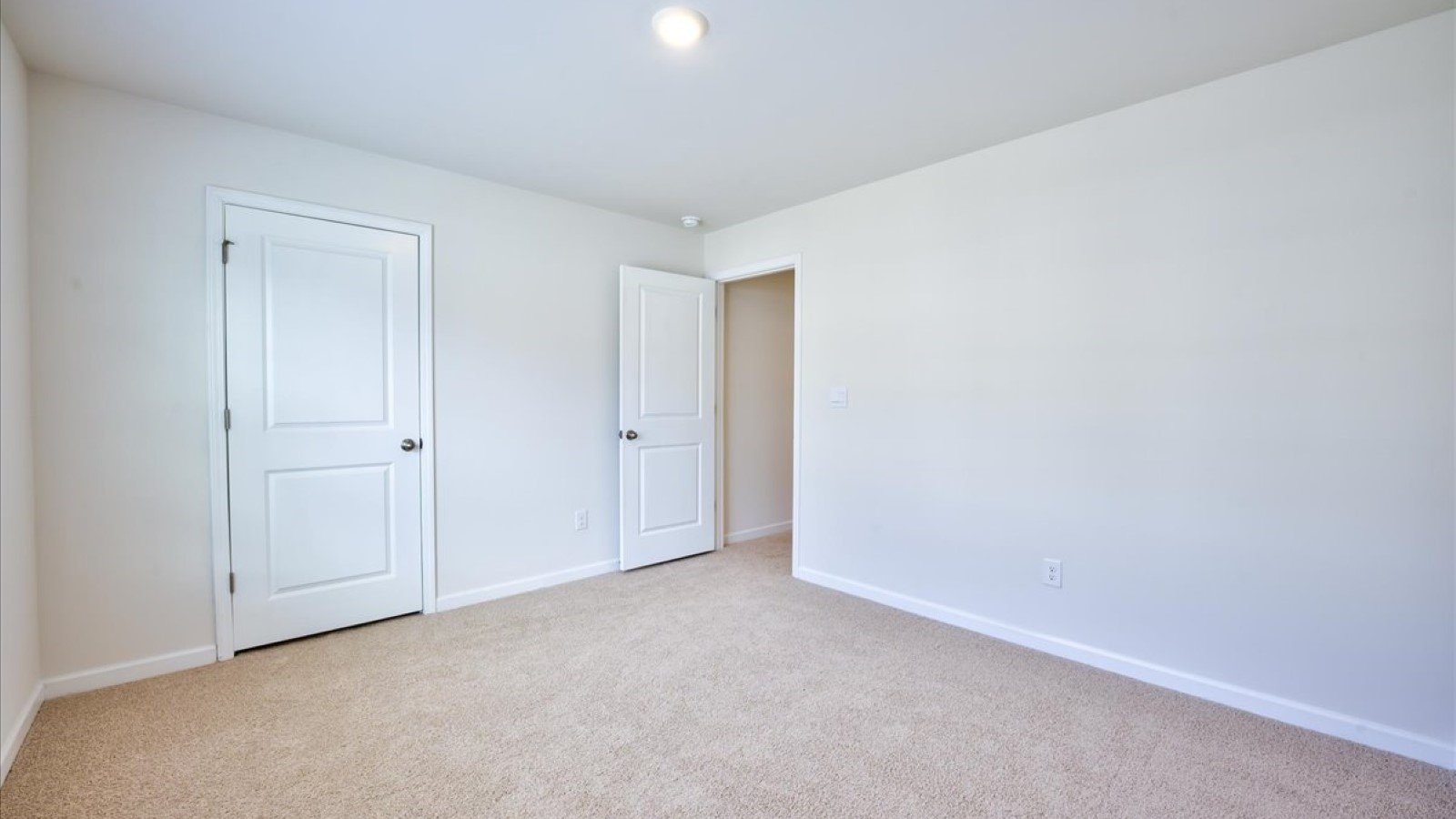 Bedroom with carpet flooring