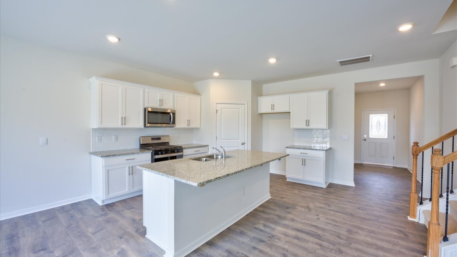 kitchen area with island and stainless steel appliances