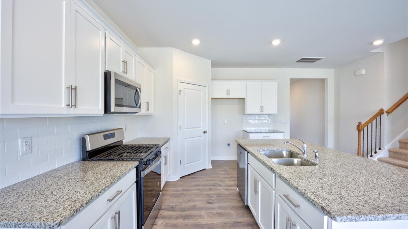 kitchen area with island and stainless steel appliances