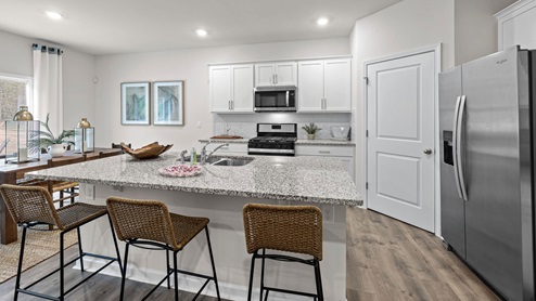 Kitchen with granite counters and stainless steel appliances