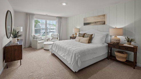 Bedroom with carpet flooring and large window