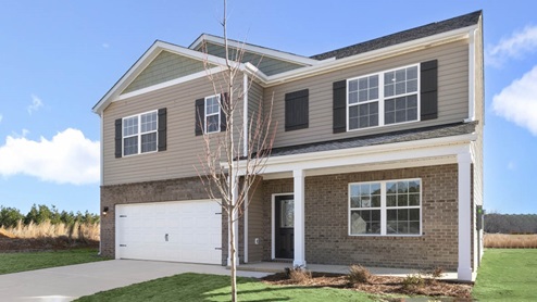 Two story home with two car garage and bedroom above garage
