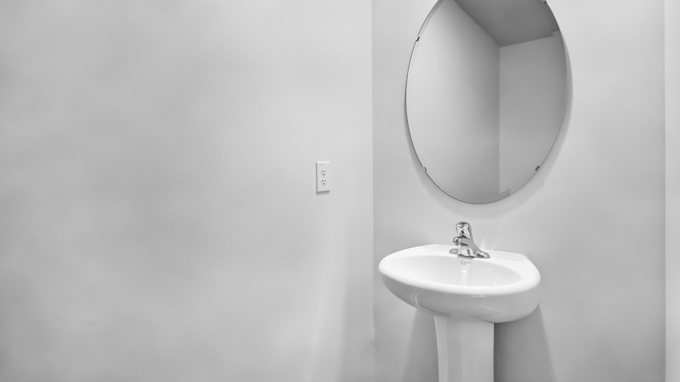 Bathroom with white cabinets