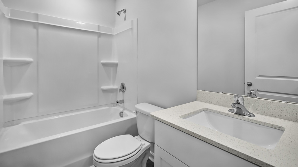 Bathroom with white cabinets