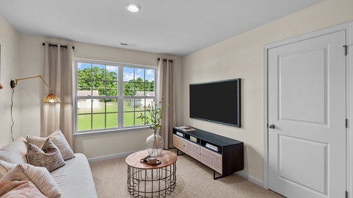 Loft area with carpet flooring