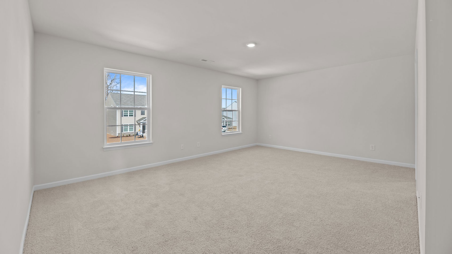 Primary bedroom with carpet flooring