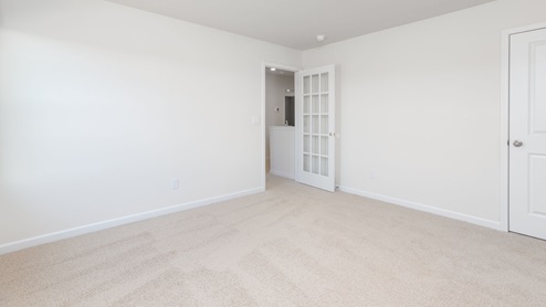 bedroom with carpet flooring and window for natural light