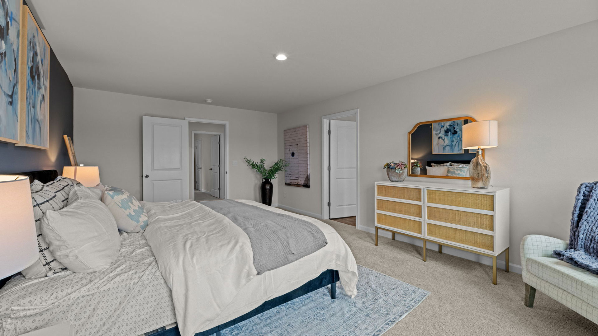 Primary bedroom with carpet flooring