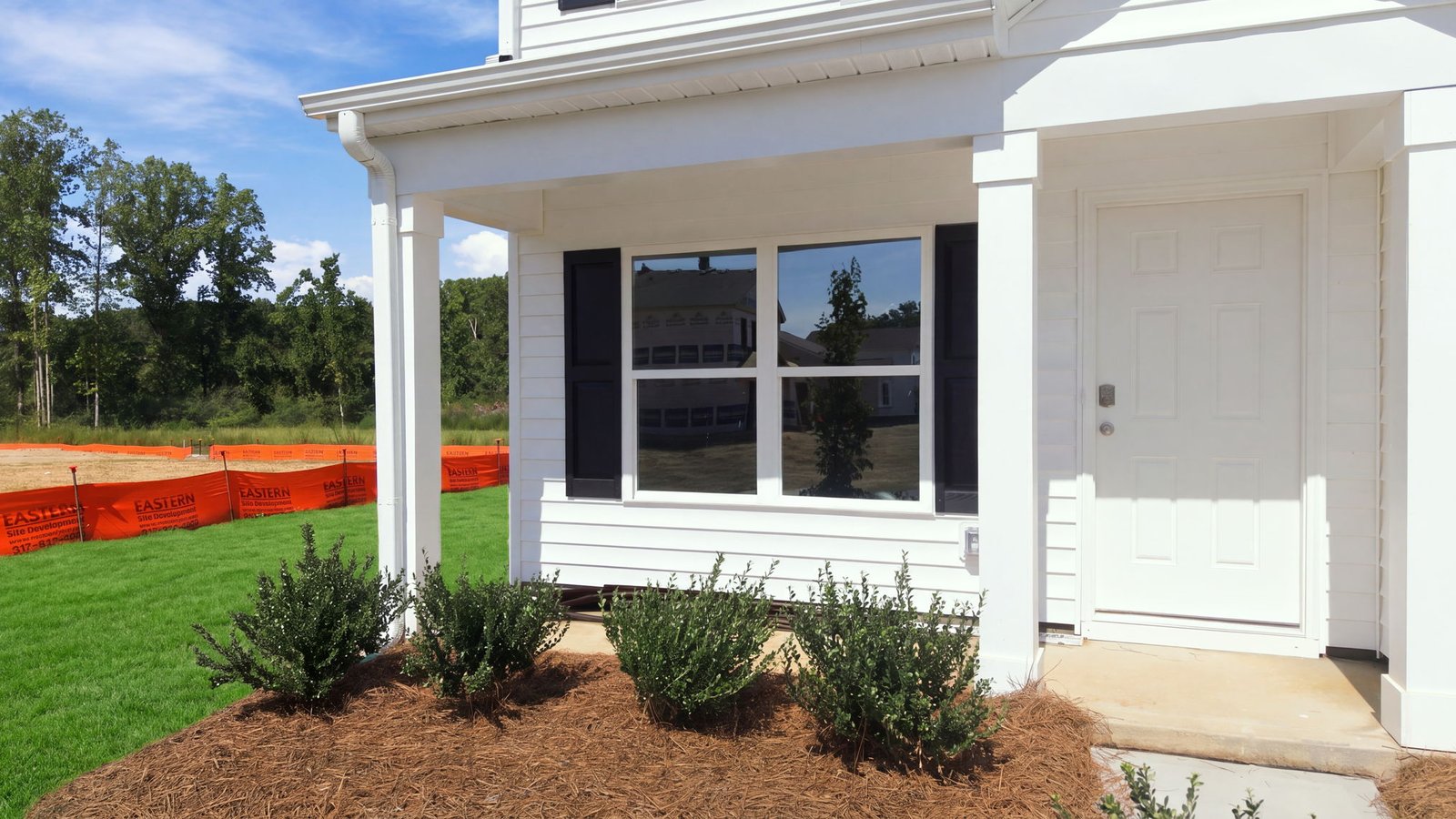 exterior of two story white home