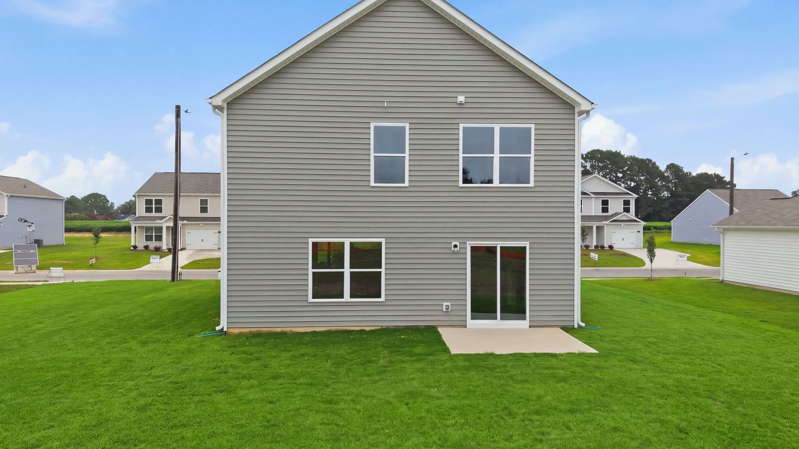 rear view and back yard view of home