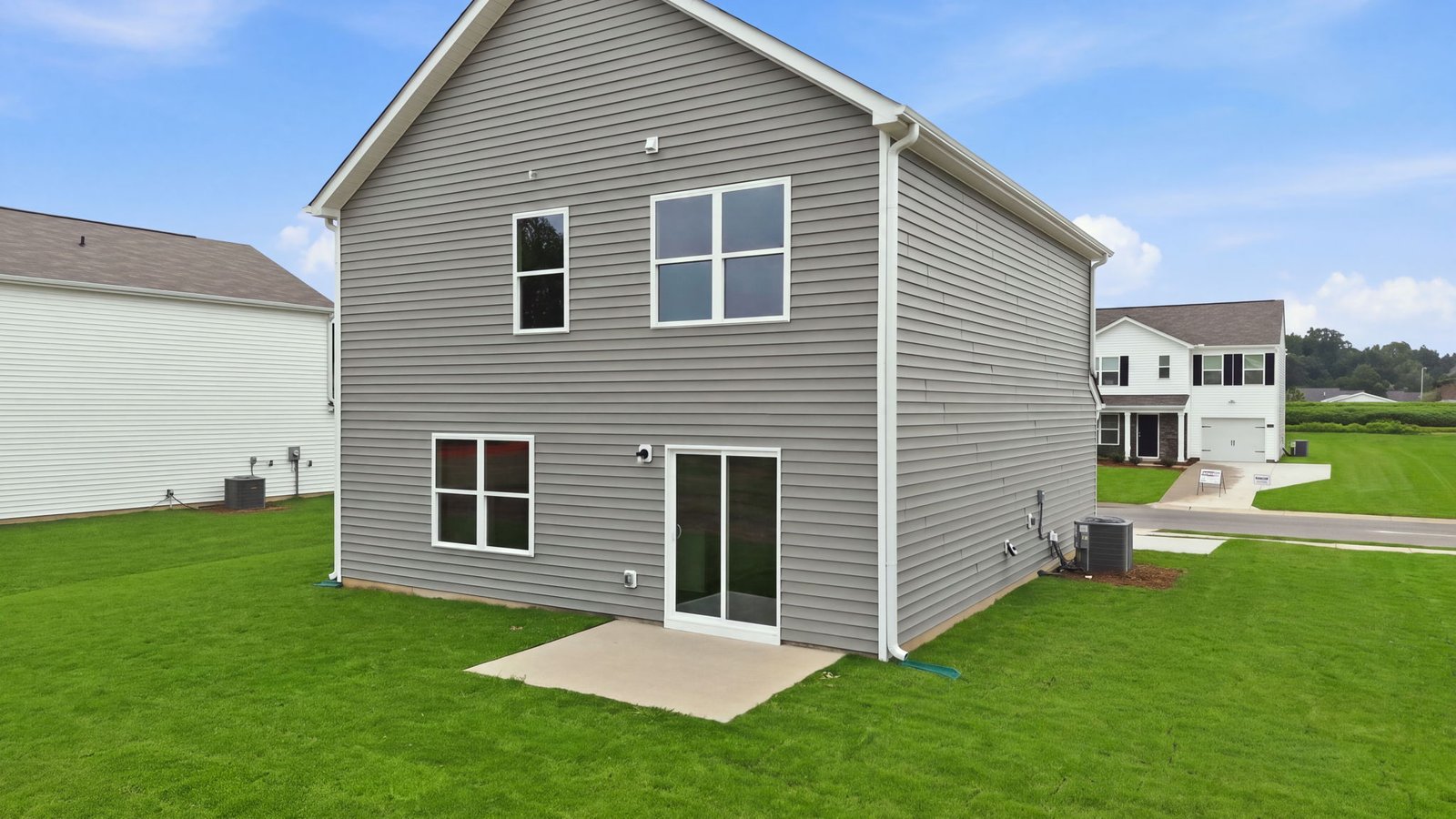 rear view and back yard view of home