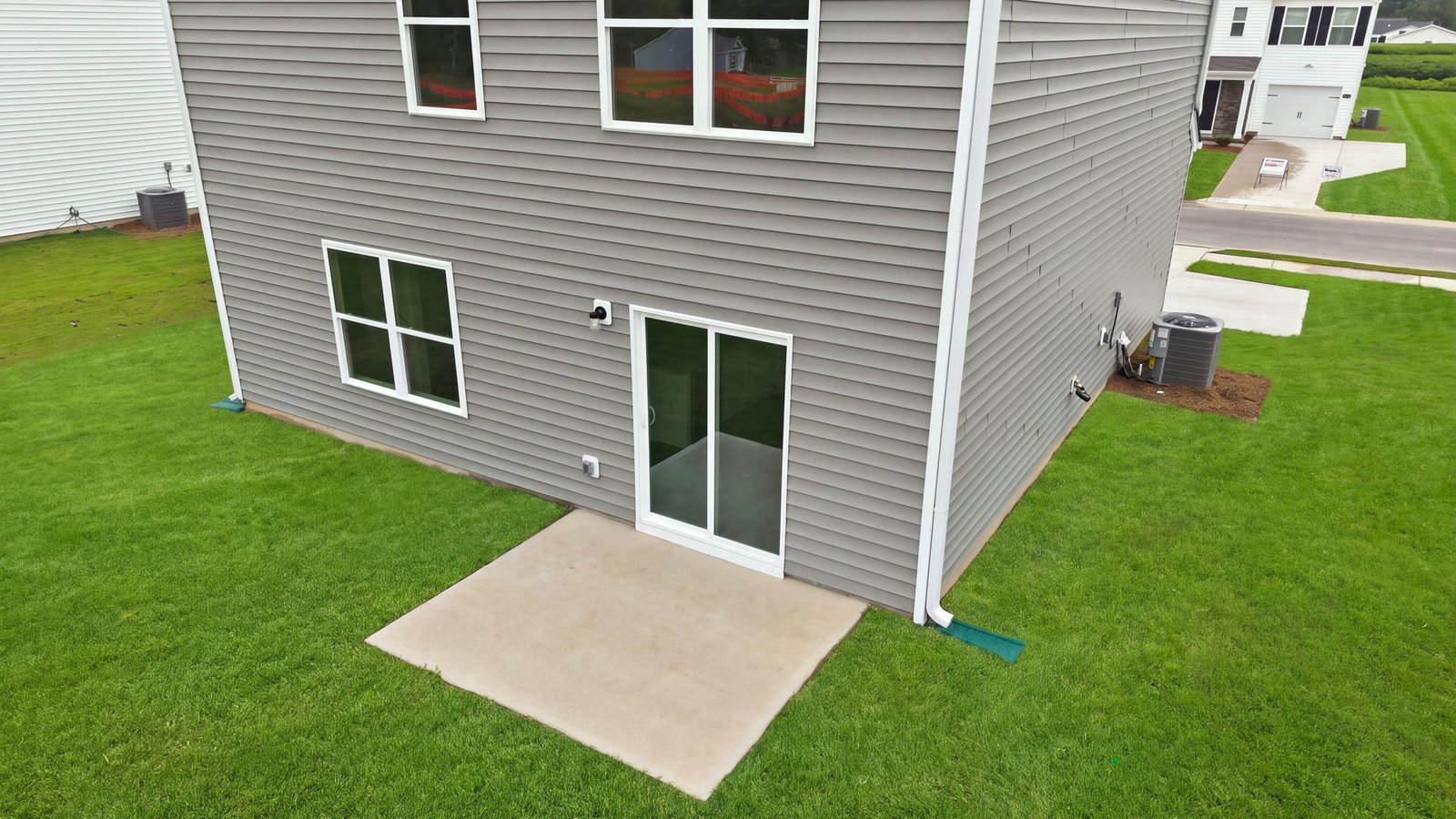 rear view and back yard view of home