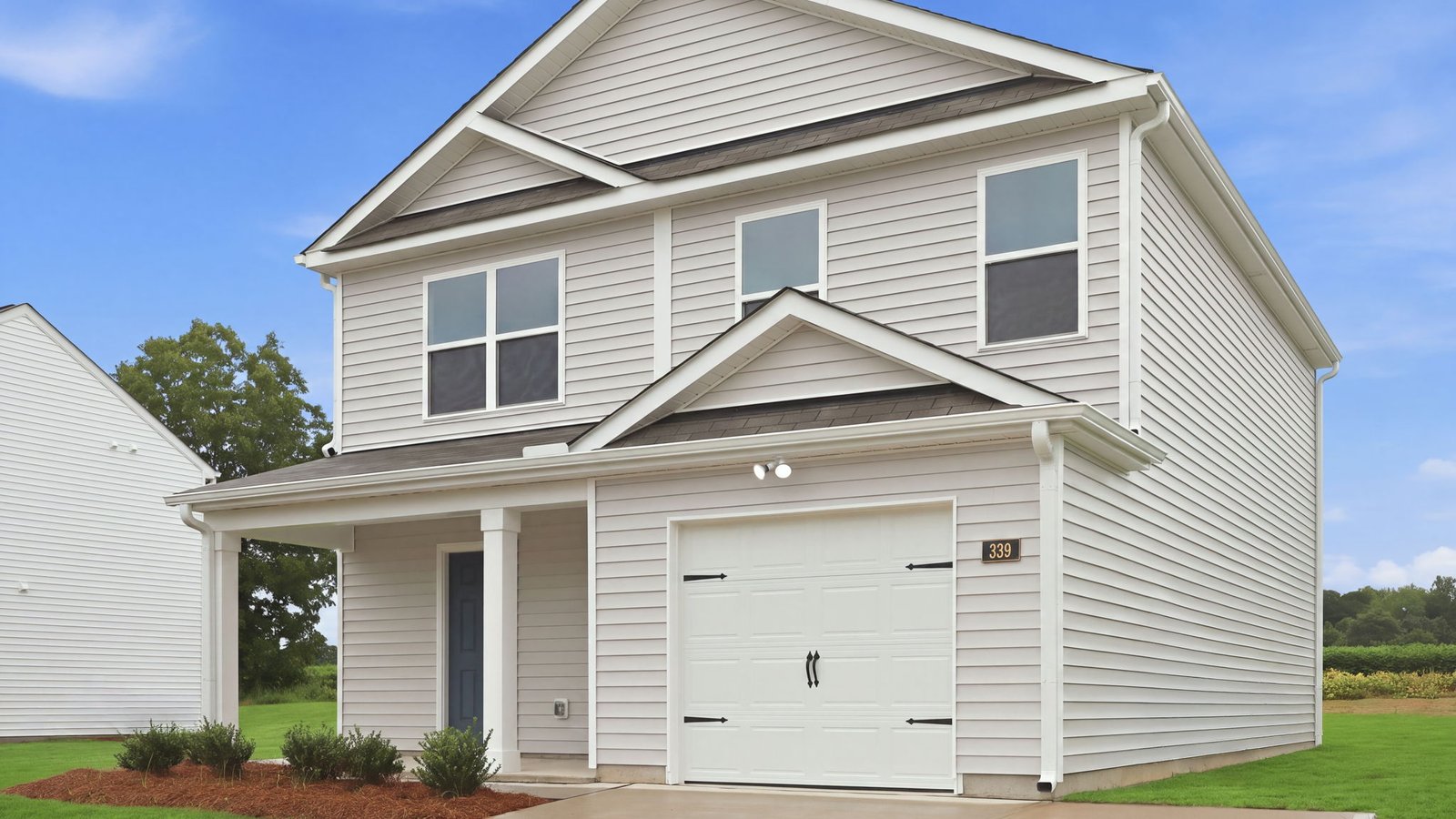 garage view with covered front porch