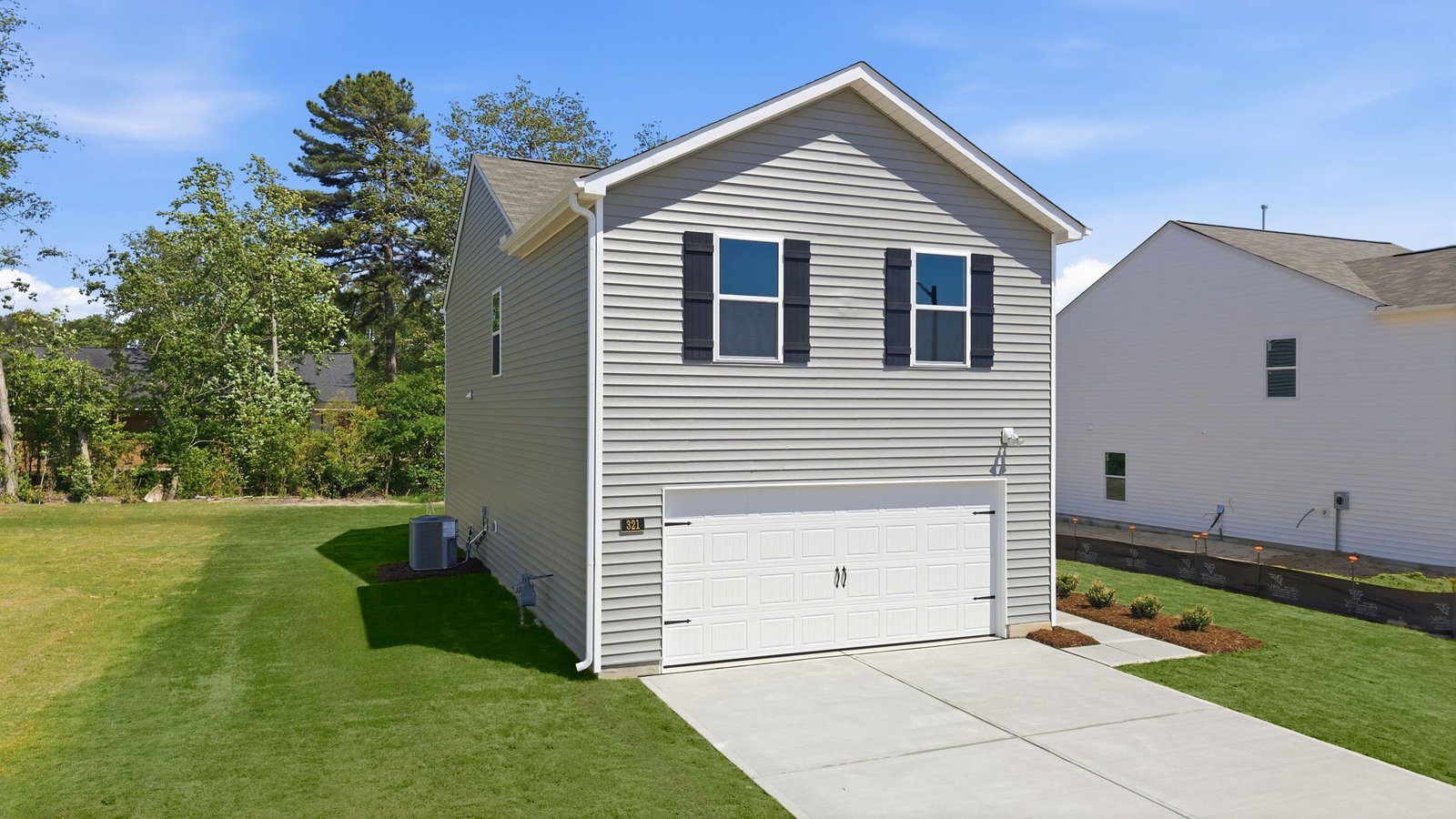 two story vinyl home with attached garage