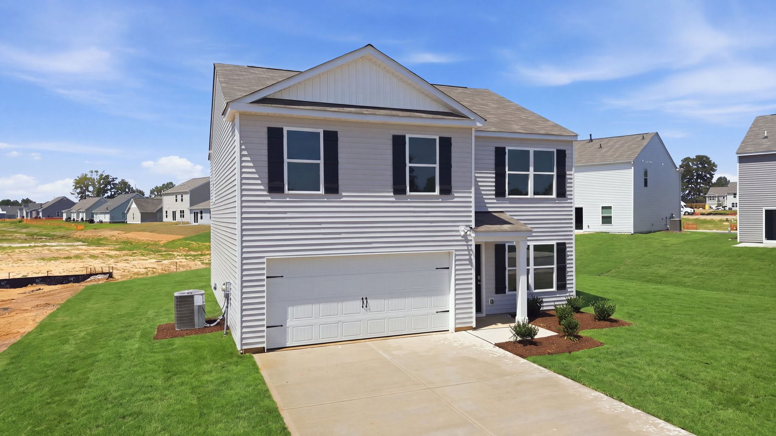 rear view of two story home and back yard