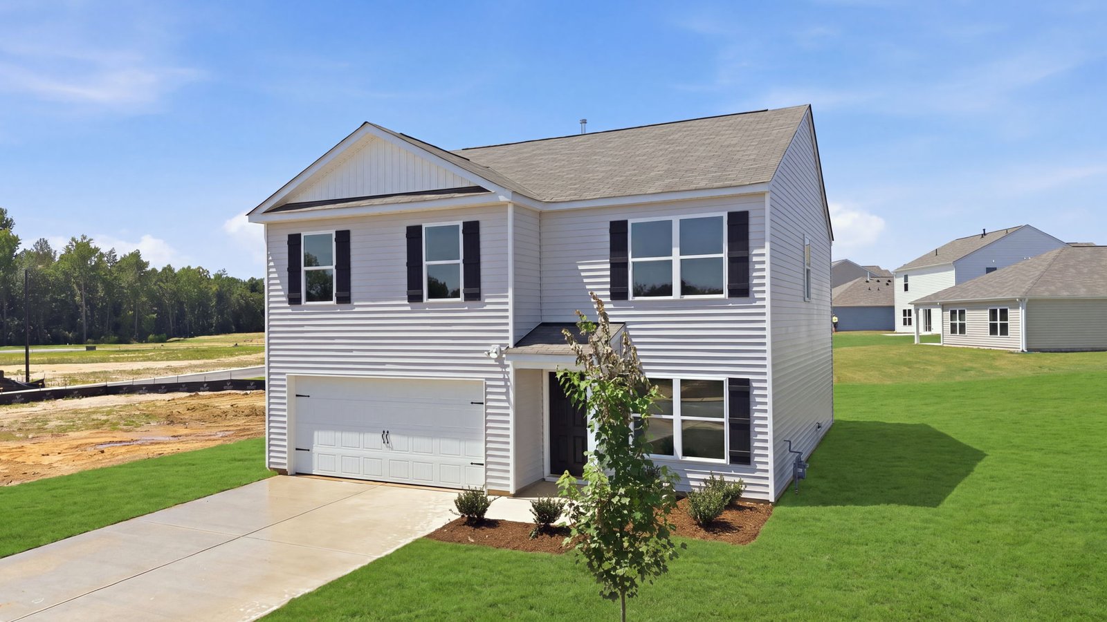 rear view of two story home and back yard