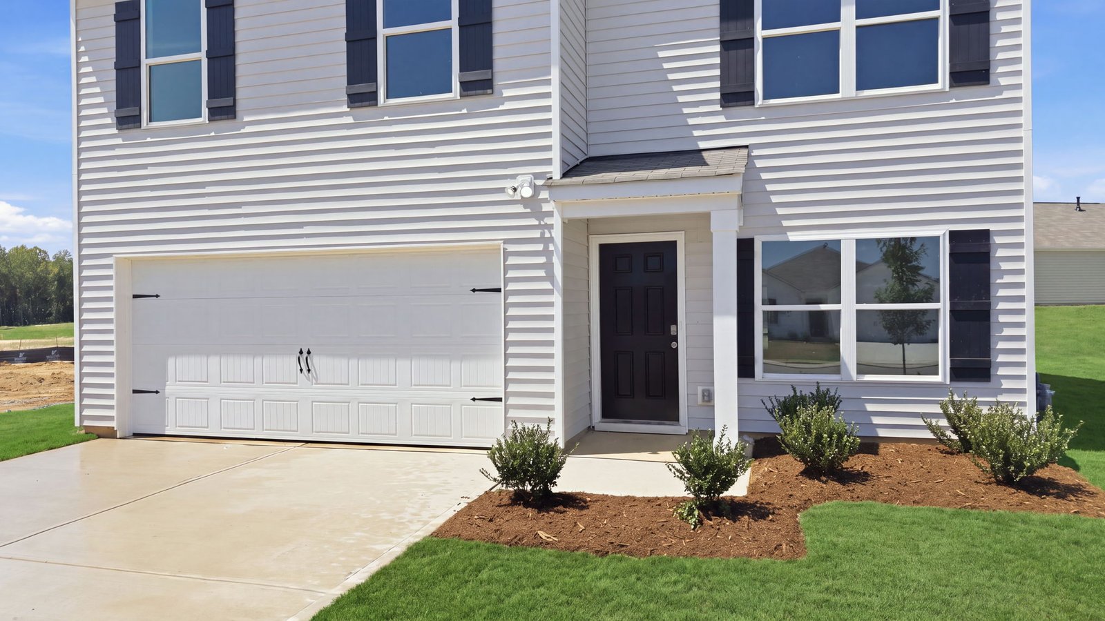 rear view of two story home and back yard
