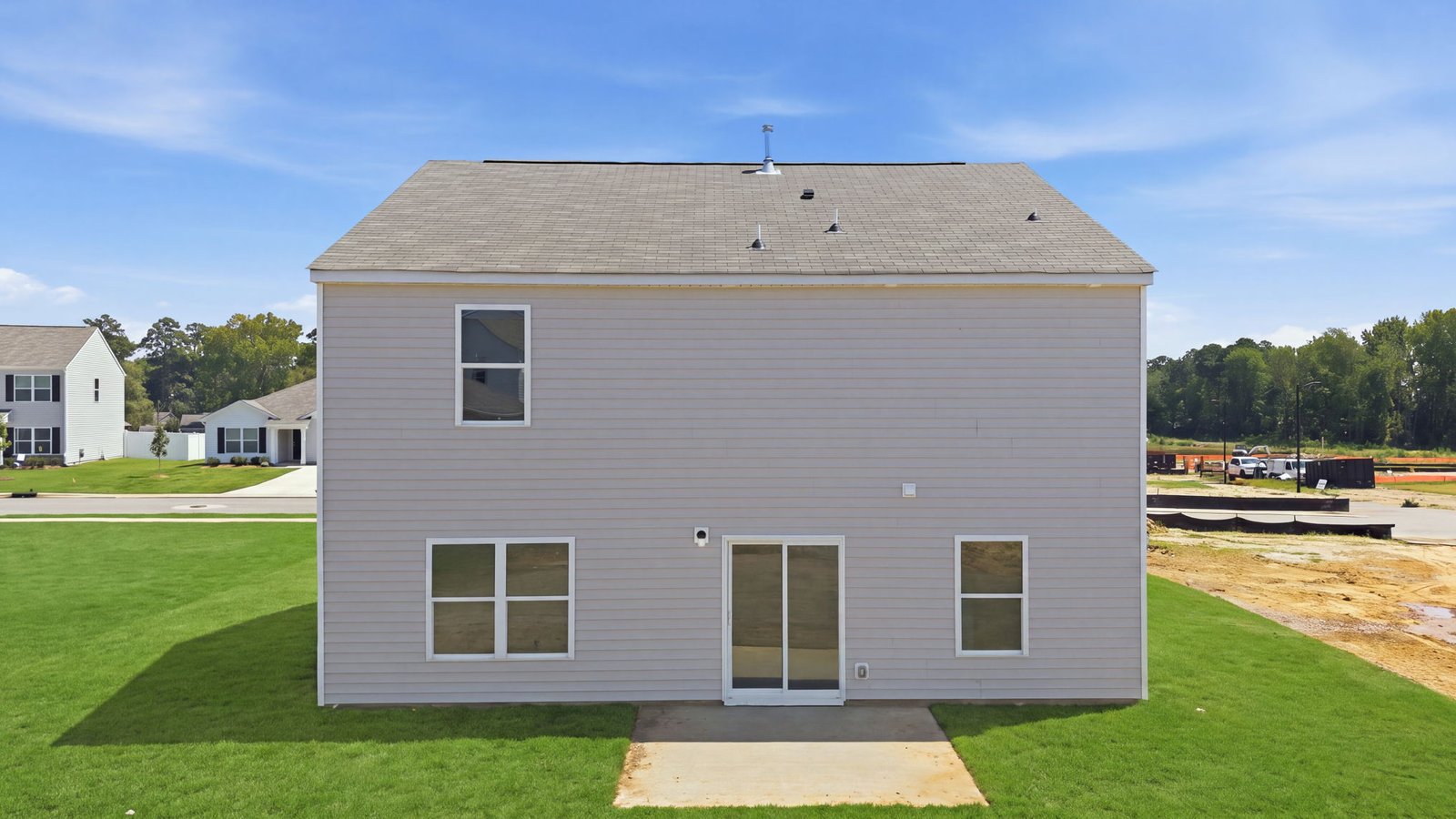 rear view of two story home and back yard