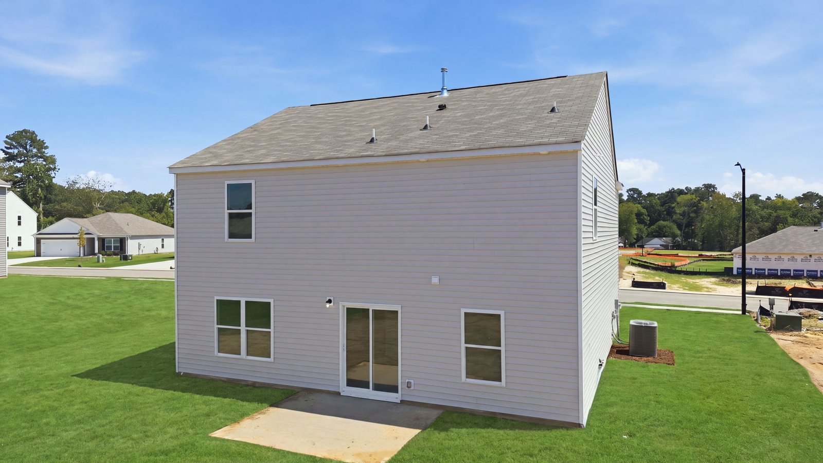 rear view of two story home and back yard