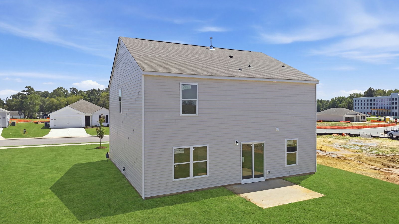 rear view of two story home and back yard