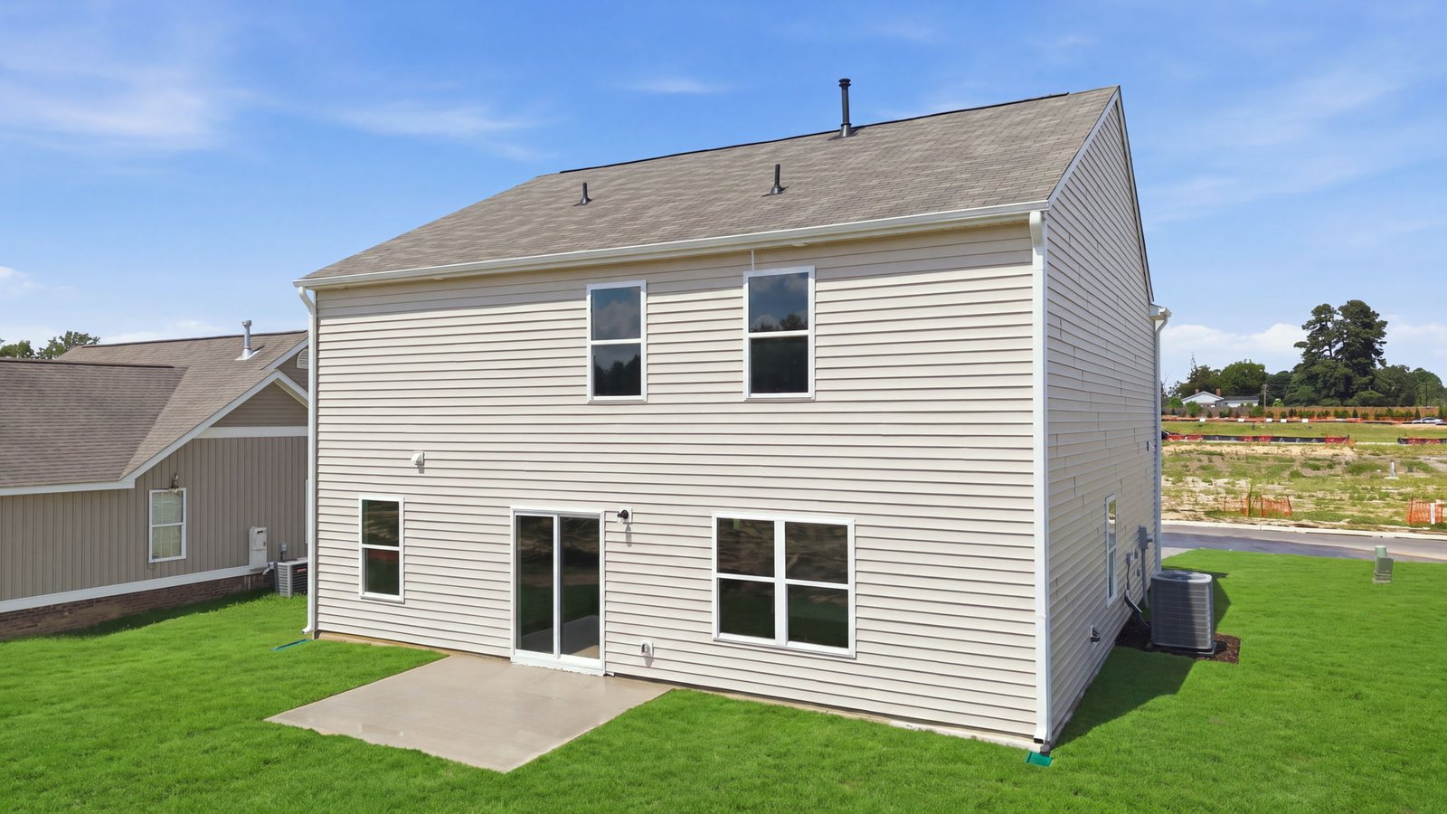 rear view of home and back patio pad