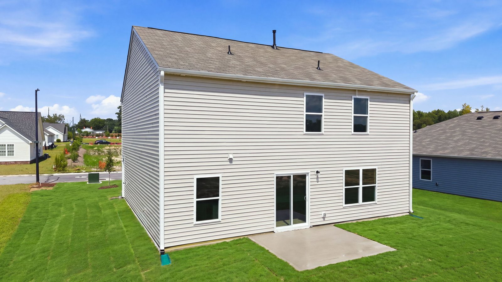 rear view of home and back patio pad