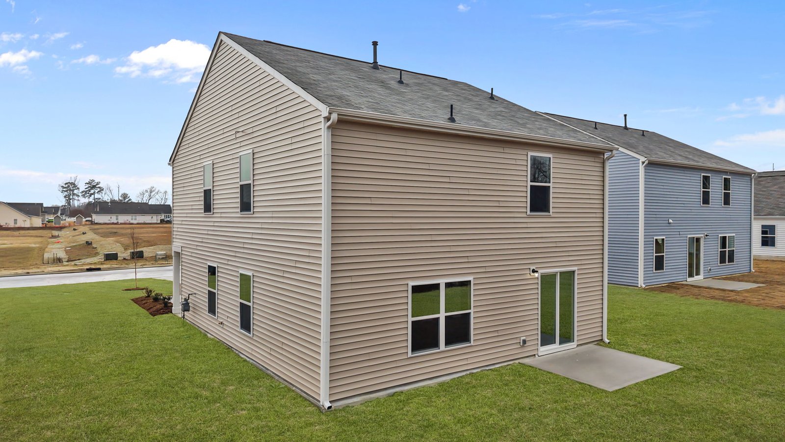 rear exterior of home with back patio