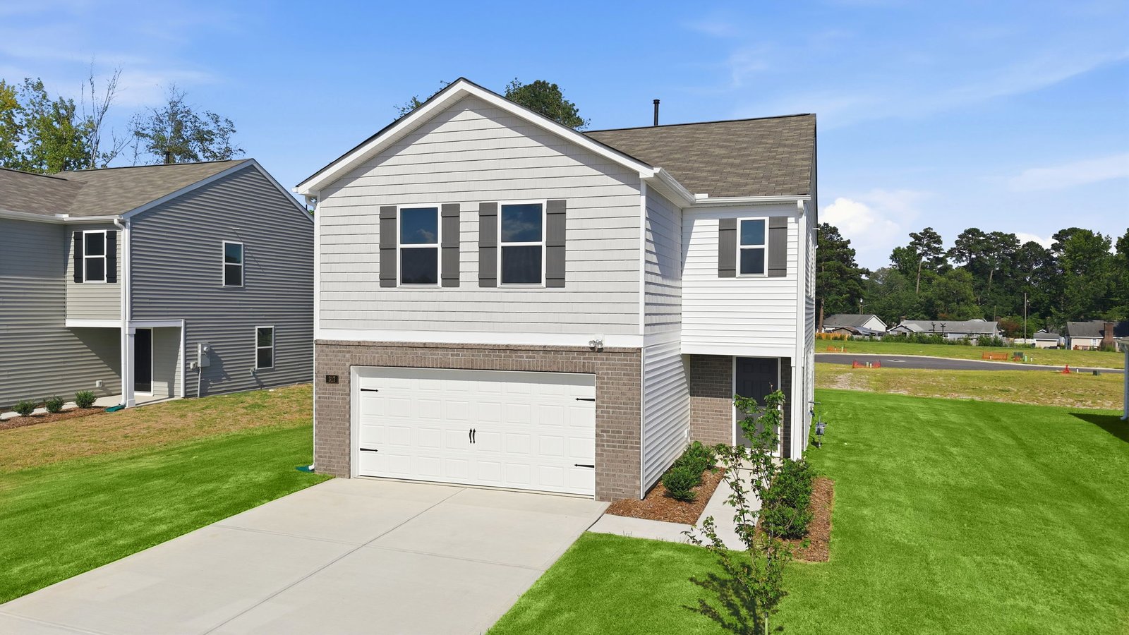 exterior of two story home with two car garage