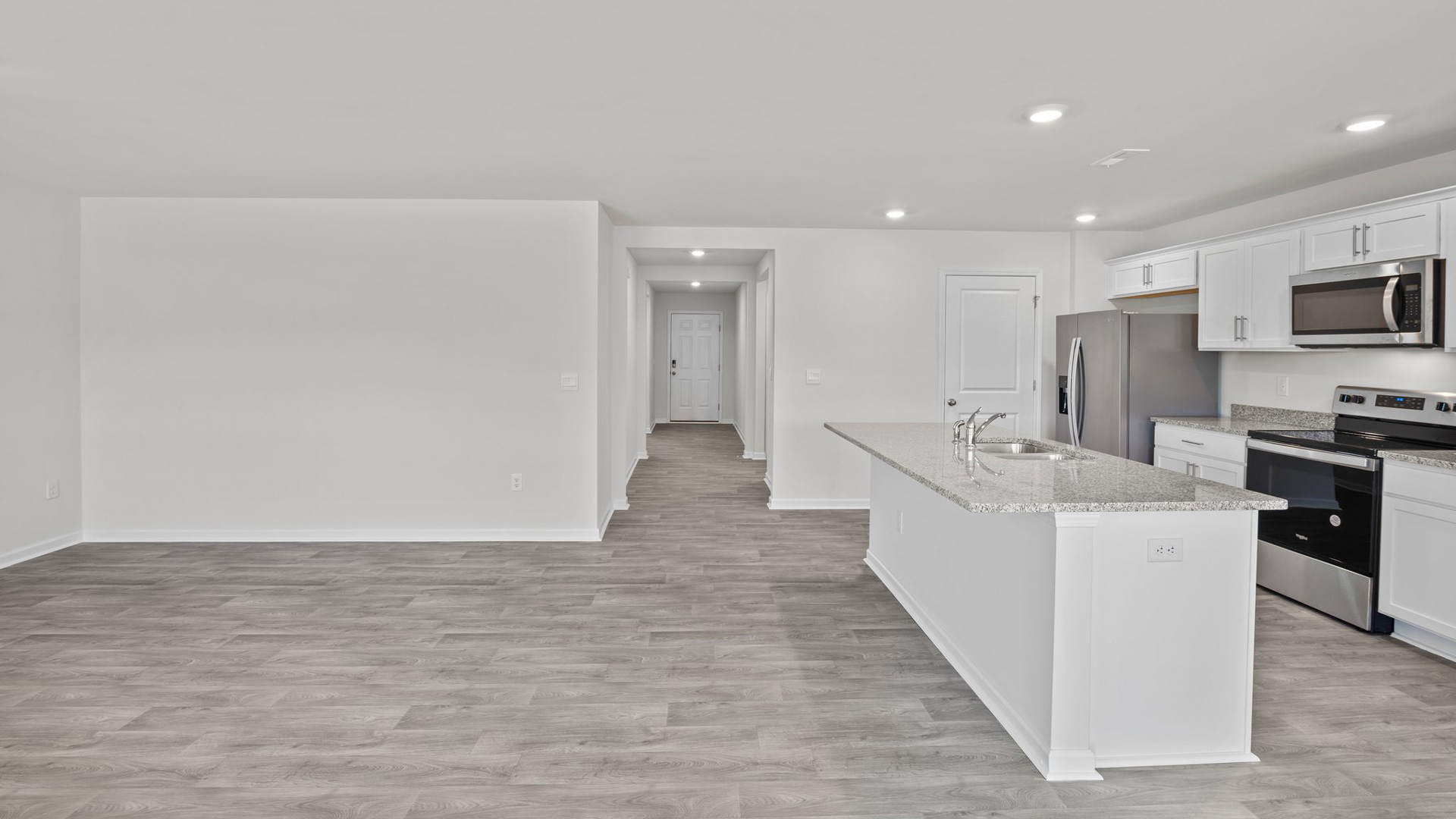 front entryway to living room / kitchen