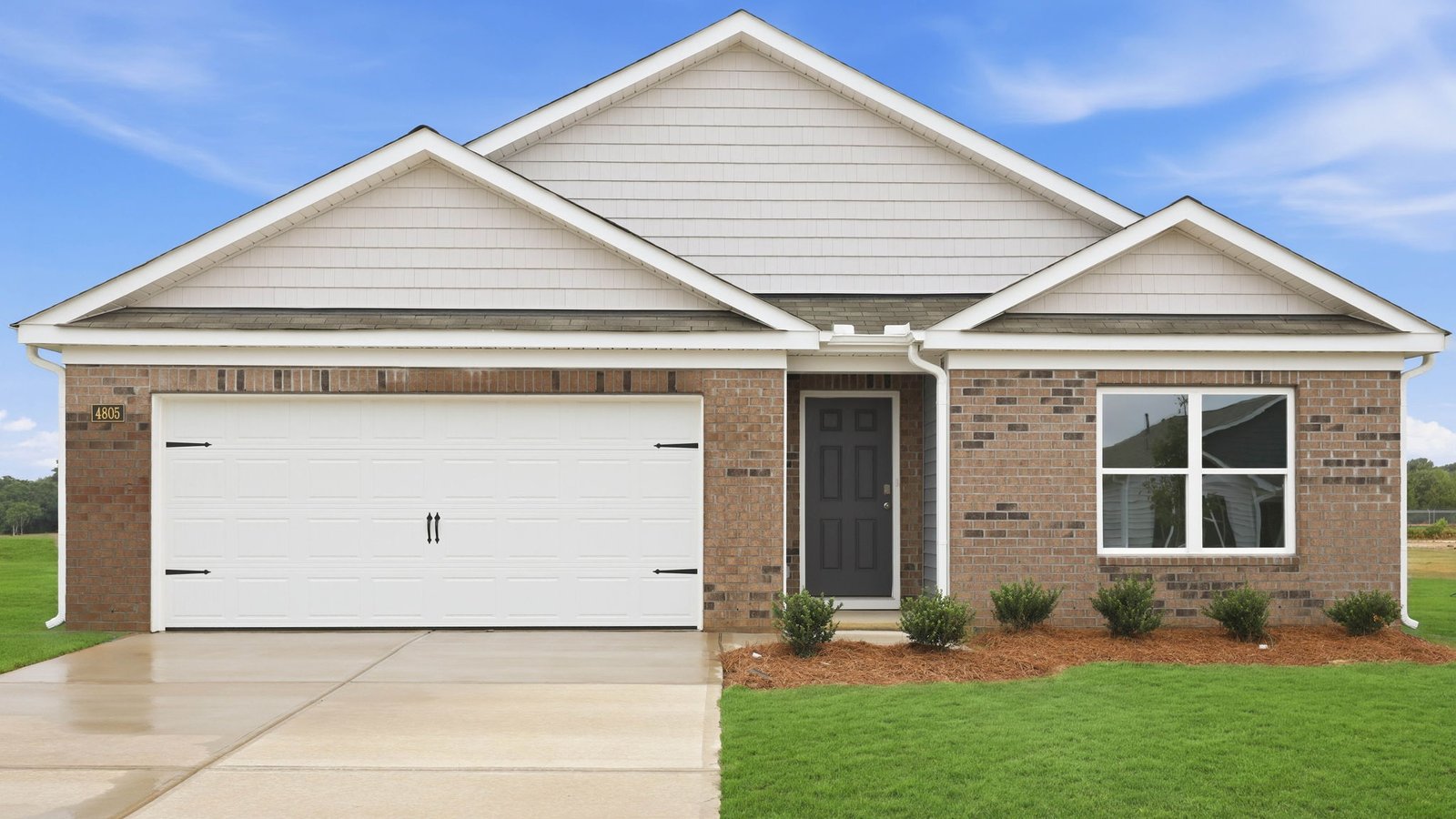 one story brick and vinyl ranch style home
