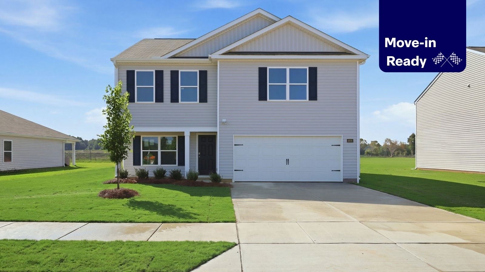 exterior of two story home with vinyl and two car garage