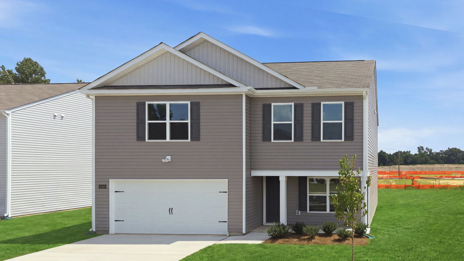 front view of two story home with two car garage