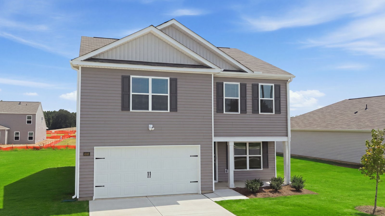 front view of exterior of two story home with two car garage