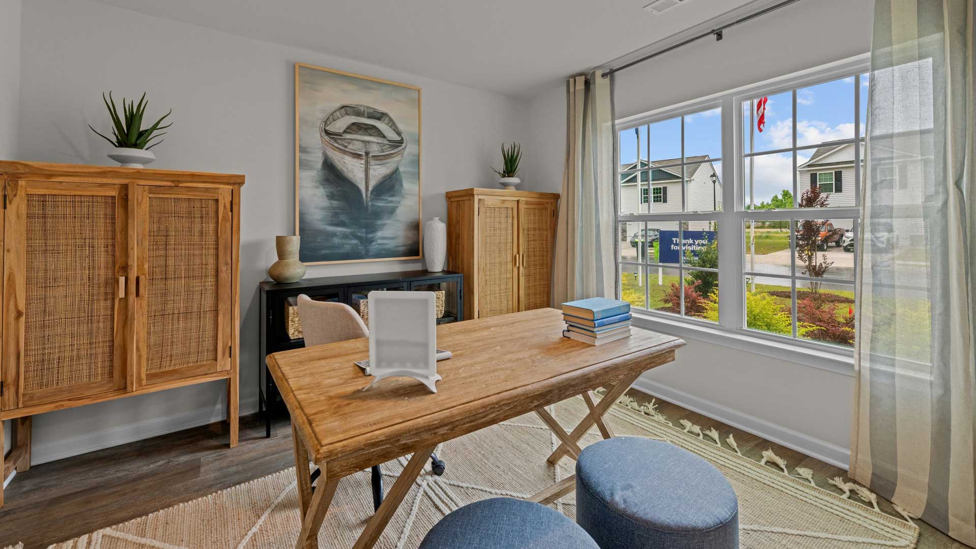 flex space with large windows located in front of the home