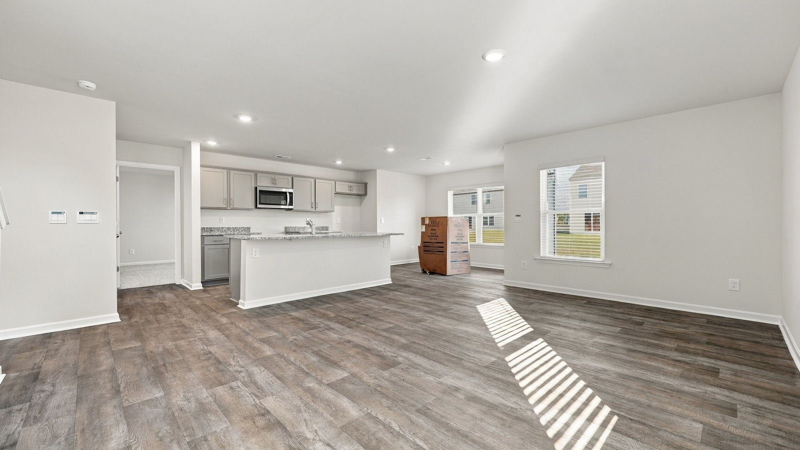 open concept living dining and kitchen area
