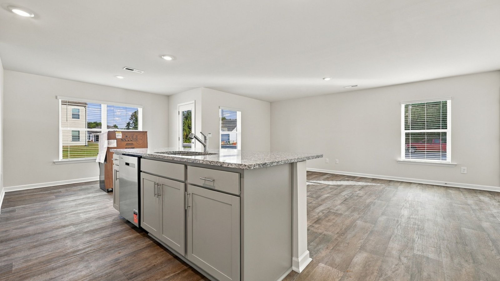 kitchen area with large kitchen island and open dining spacec