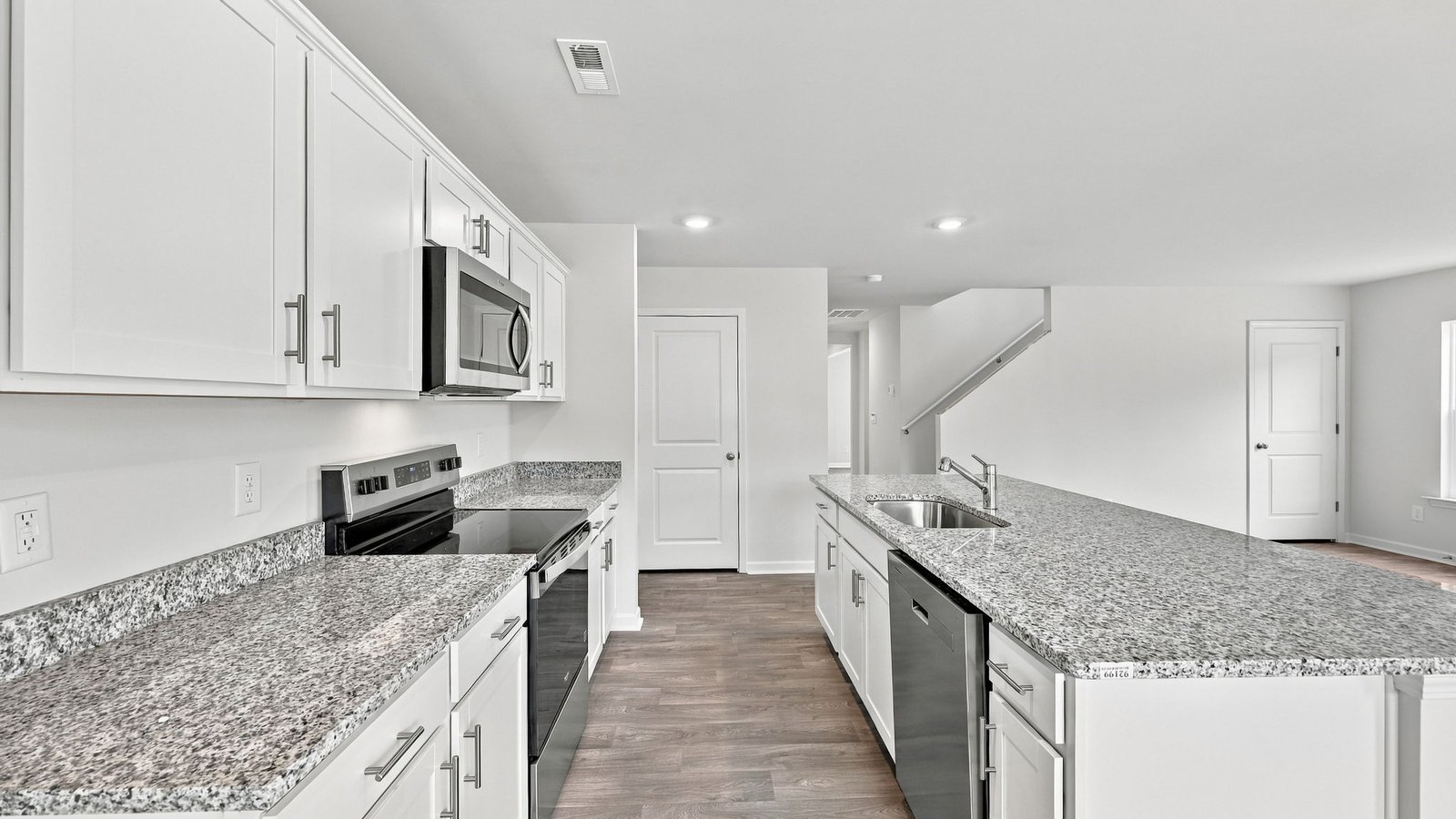 kitchen area with island and stainless steel appliances