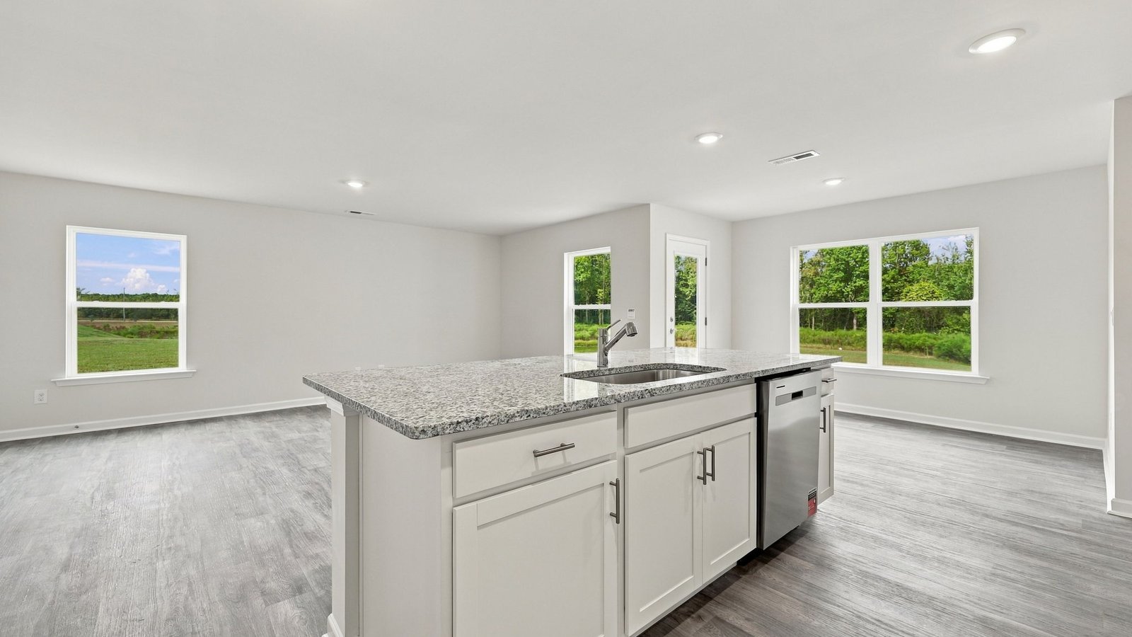kitchen area with island and stainless steel appliances