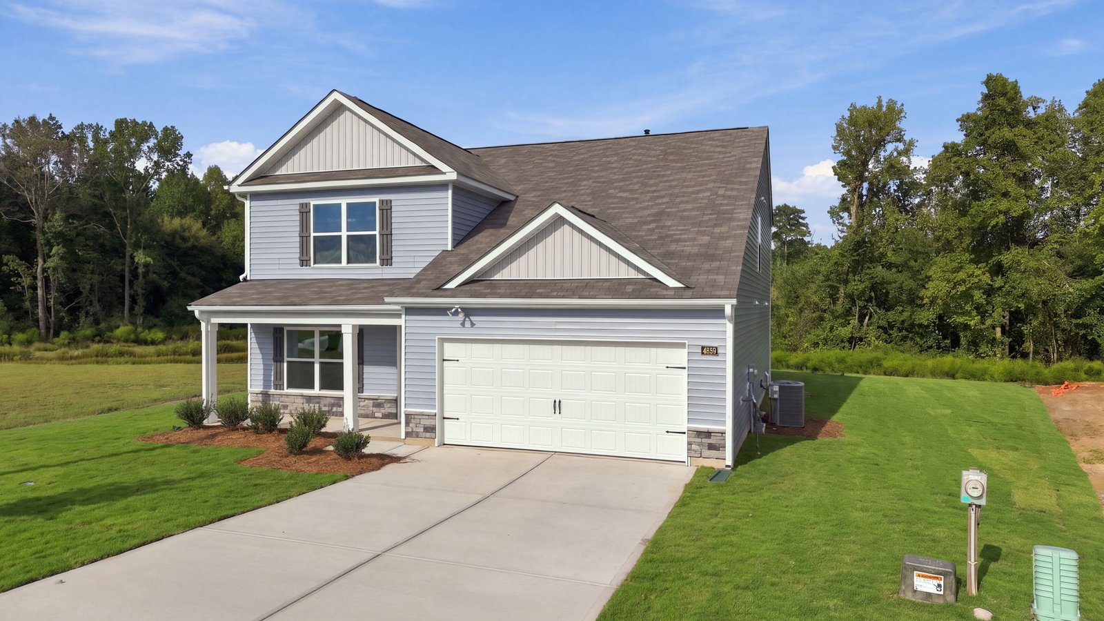 exterior of two story home  with two car garage