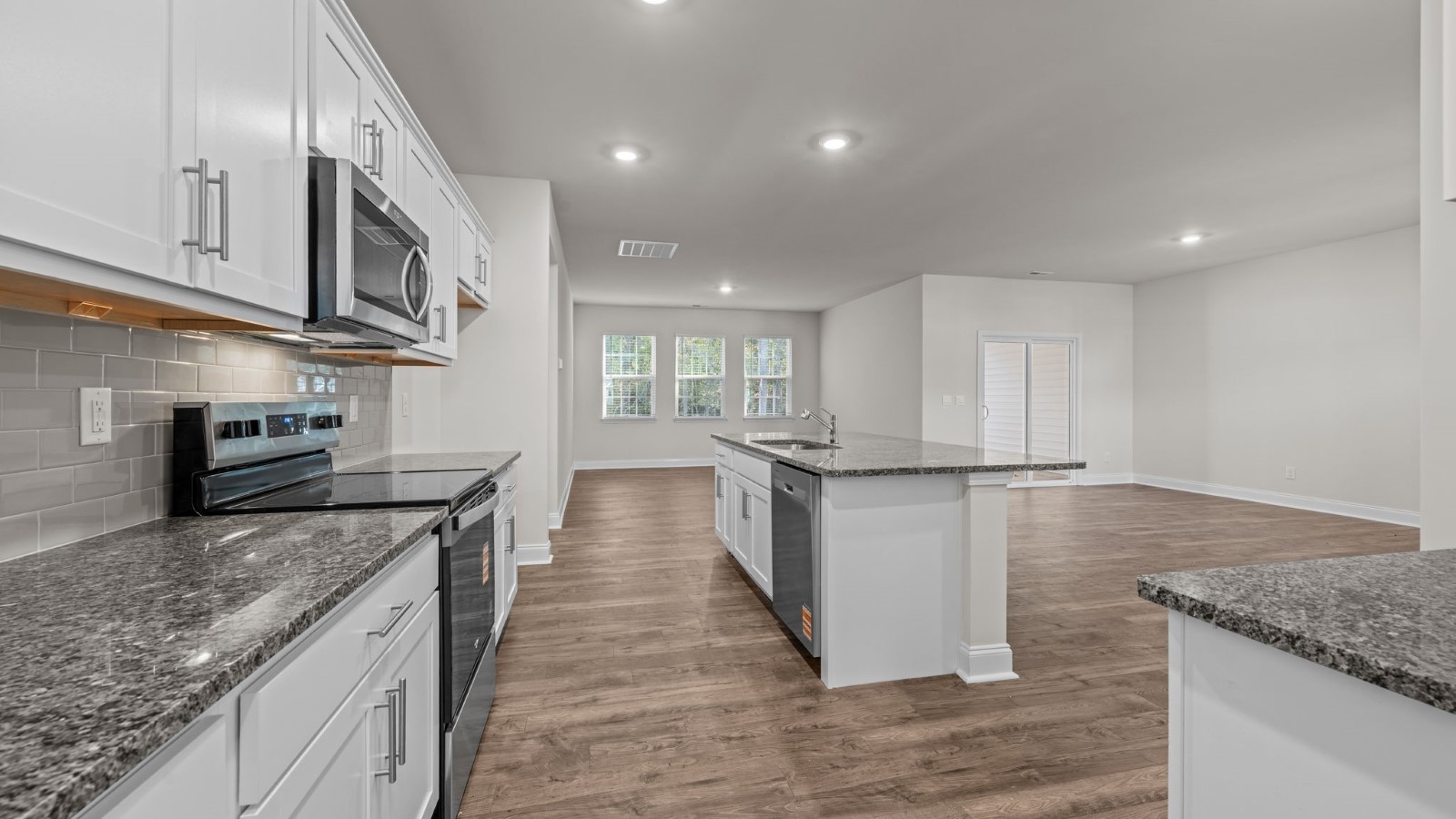 kitchen area with white cabinets and kitchen island