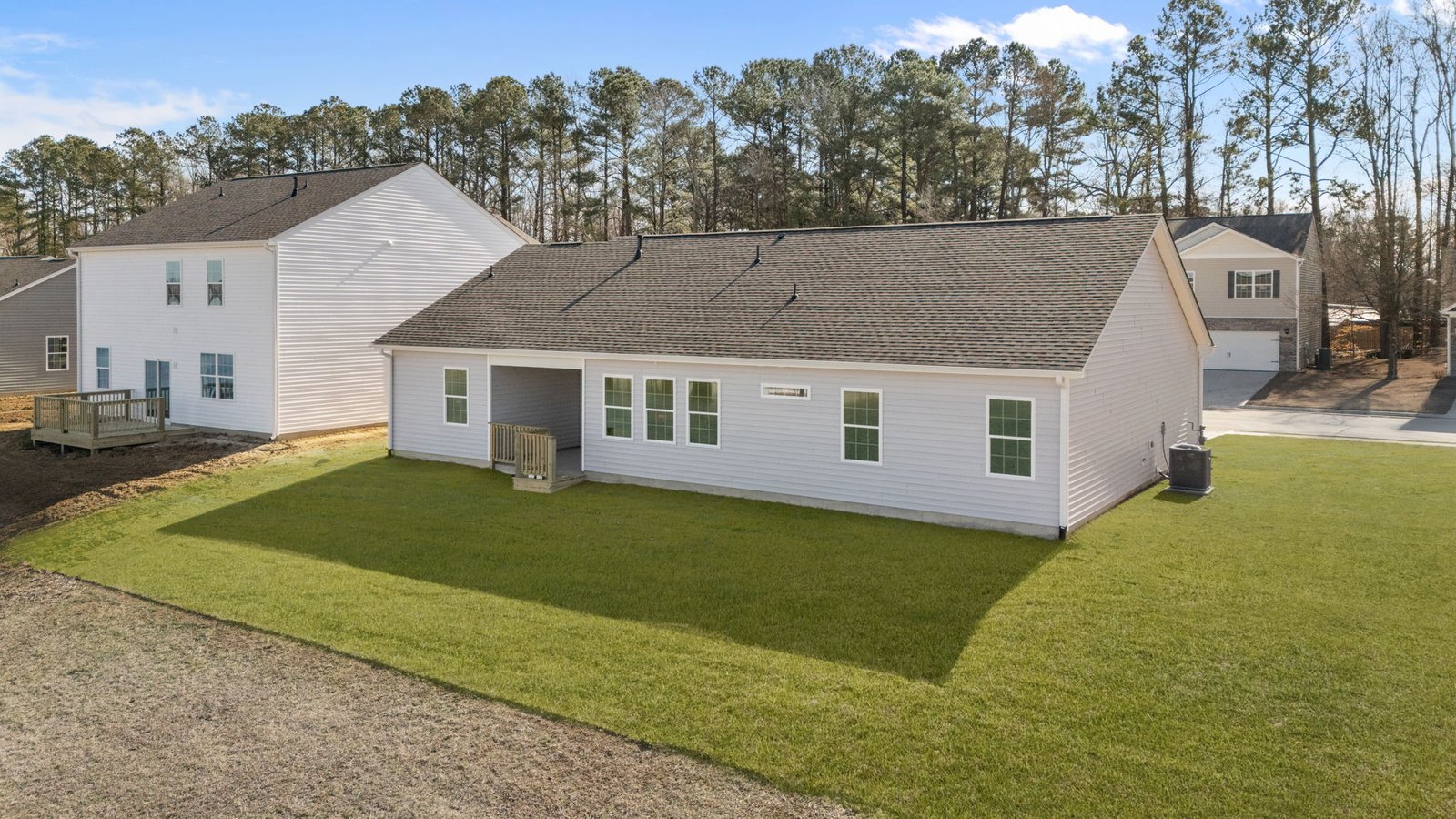 rear view of home with yard view