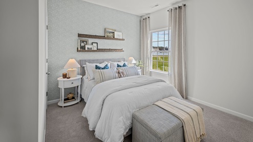 Bedroom with carpet flooring and window