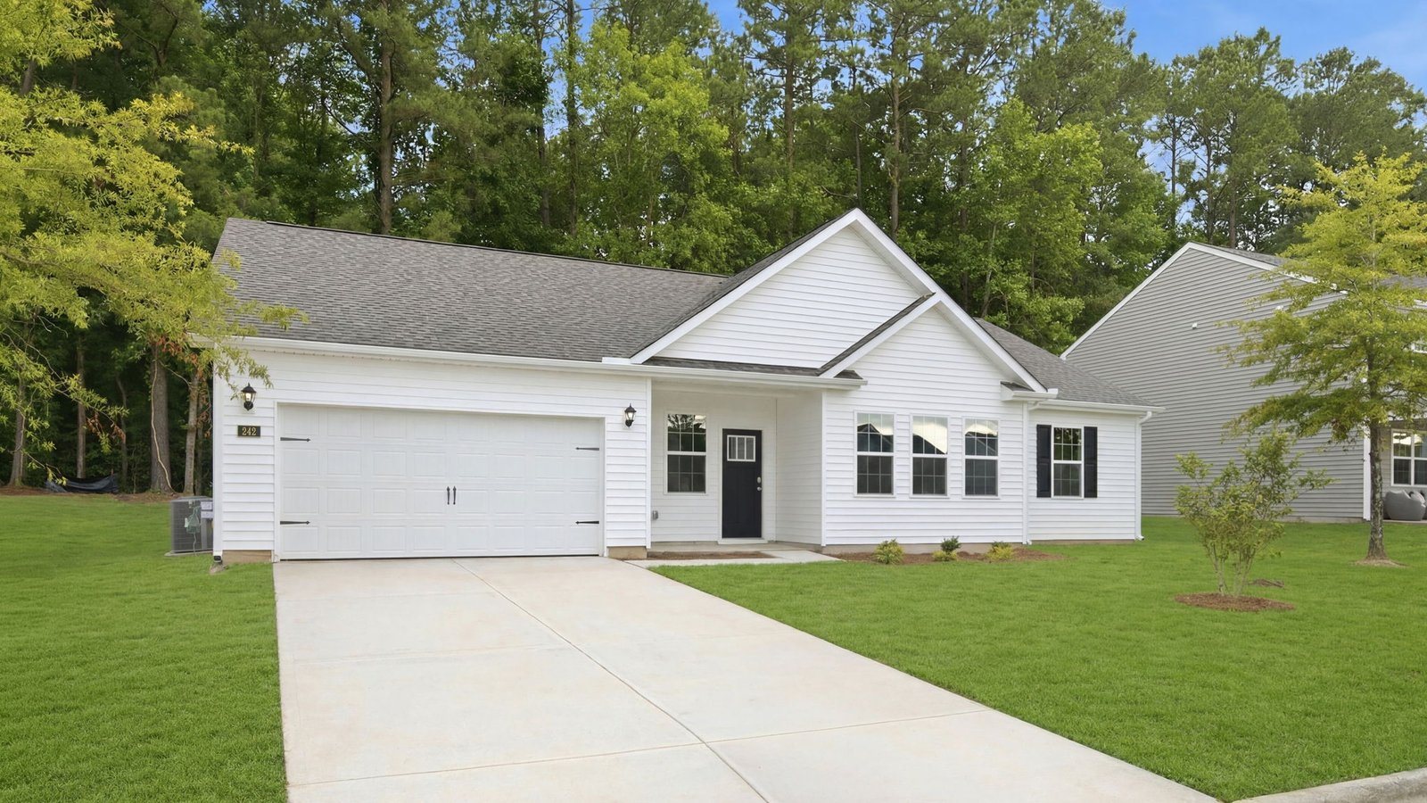 front of one story mills plan with two car garage