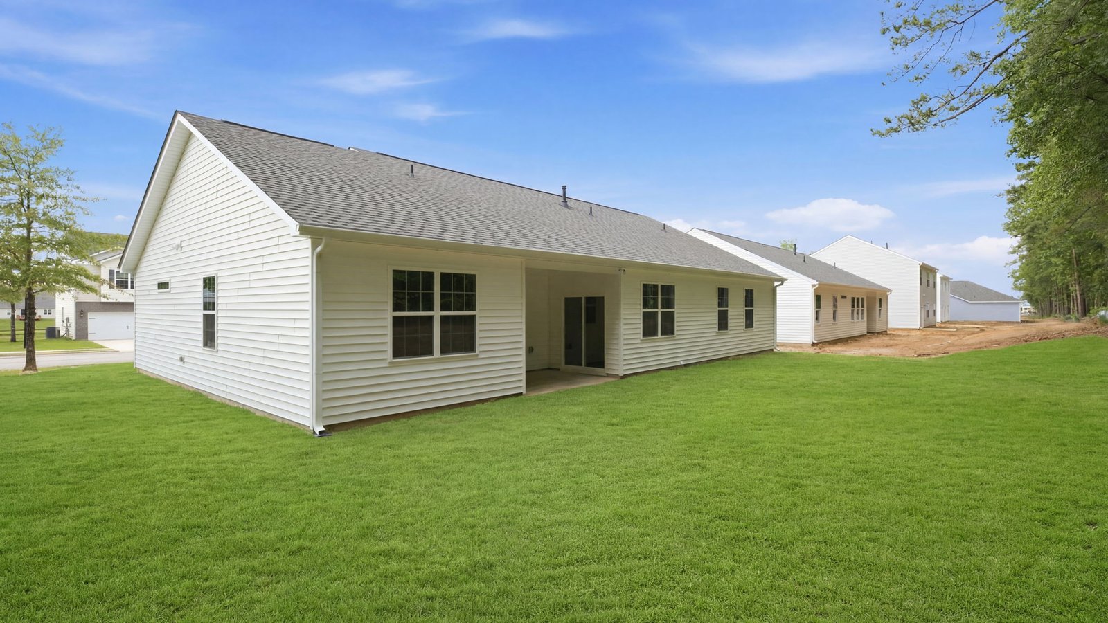 rear view of back yard and home