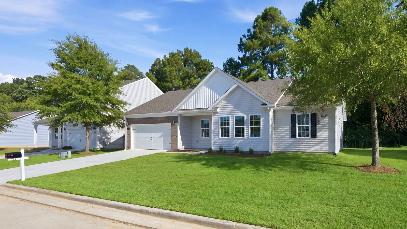 front view of ranch style home with two car garage