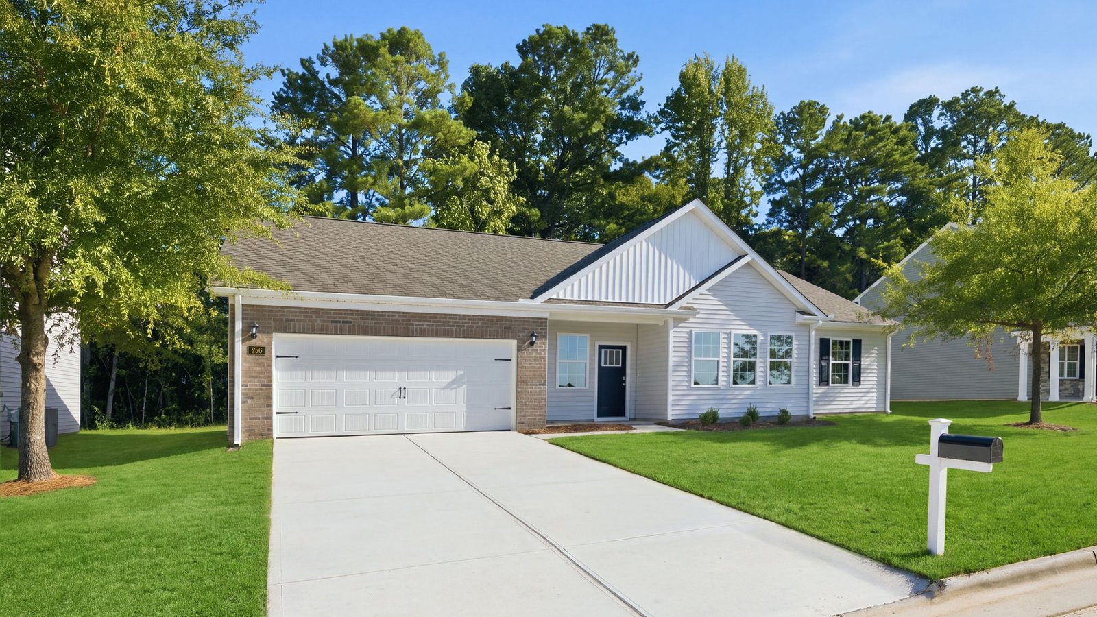 front view of ranch style home with two car garage