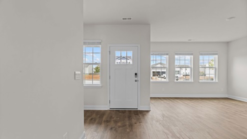 entryway with white door