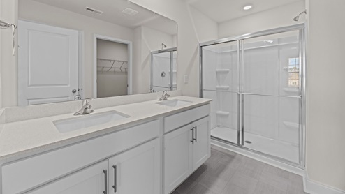 bathroom with quartz counterds