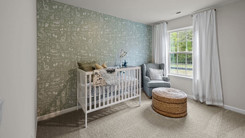 Nursery with carpet flooring and window